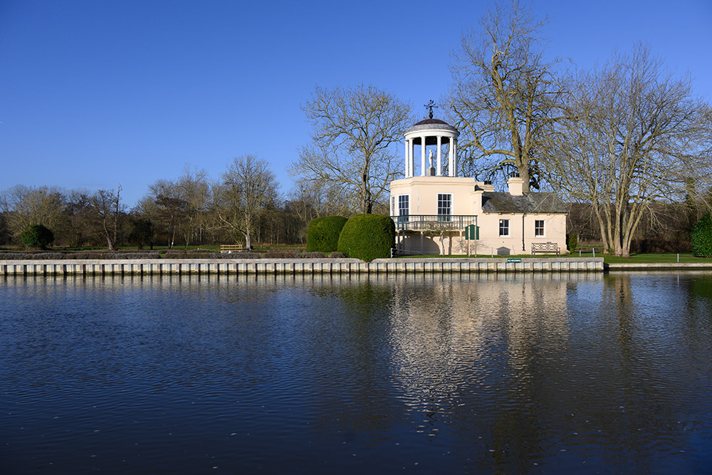 photo of reflected building in lake. Using a mid-range aperture such as f/8, is usually a safe bet for good detail levels