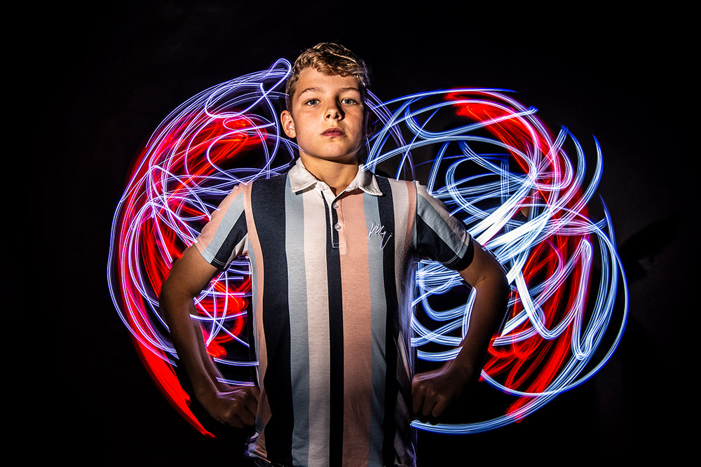 boy with light painting graphic