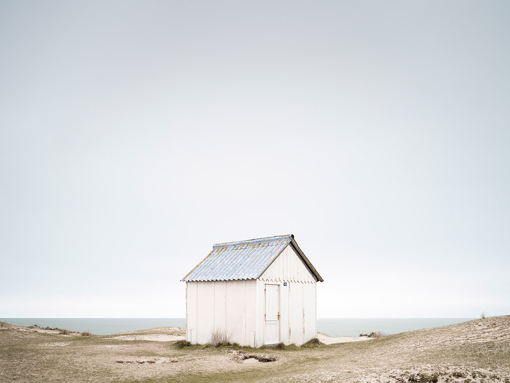 white shed on cliff minimalist landscapes