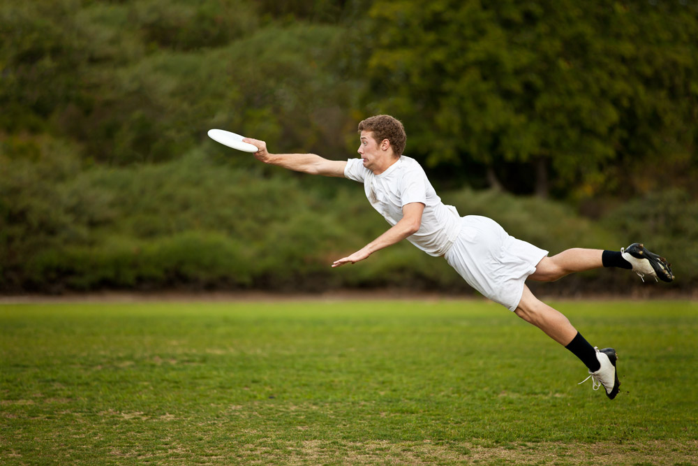 Sports photography: Young Man Catching Frisbee, Credit: drbimages, Getty Images