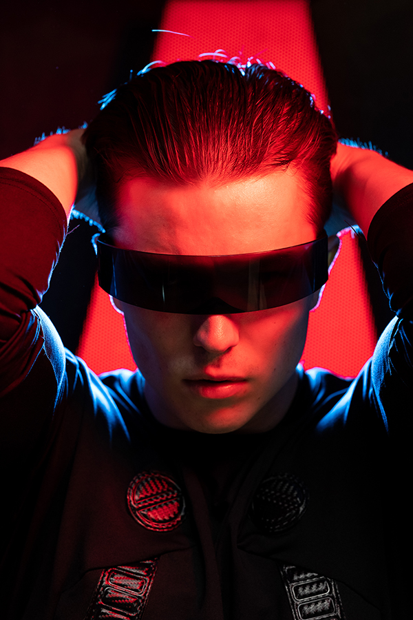 Hamish Scott @hamishwjscott_model was photographed against an illuminated red sign on the wall and lit using an AEOS 2 fitted with the SmartSoft Box, set to a matching red gel. A NEO 3 was placed directly behind the model’s head facing towards the camera, to produce the blue rim light at the rotolight sci-fi event