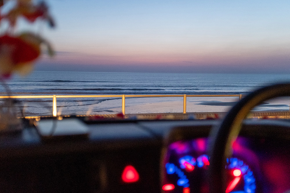 evie hitchings photo looking out of car to sea sunset University of Gloucestershire
