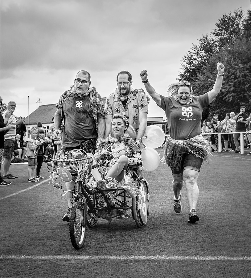 The Co-op team finishing the Ackworth pram race. Image: Lorraine Spittle disabled photographers society