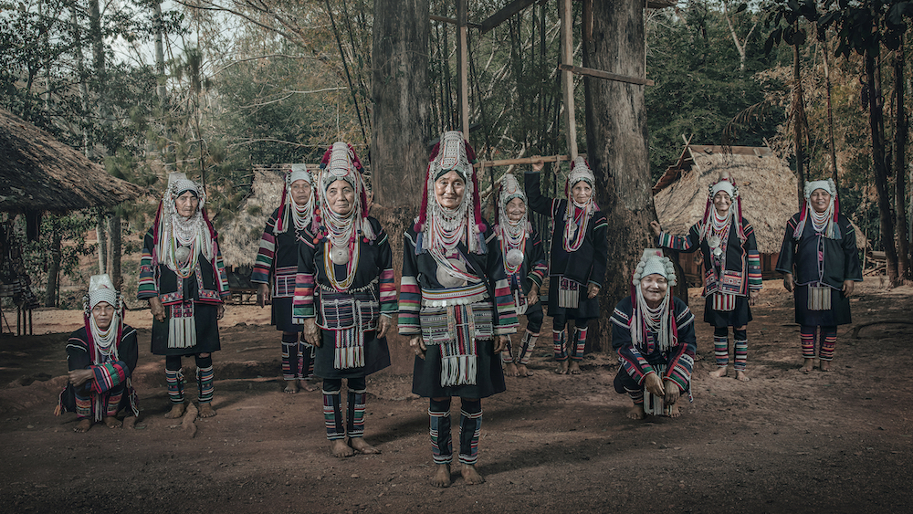 People of the Hill. This is a rare photo of the 'Akha' people that shows the traditional dress of the Akha clan in the north of Thailand. (Ulo Akha, Pamee Akha, Loni Akha). © Jatenipat Ketpradit/International Portrait Photographer of the Year 2022