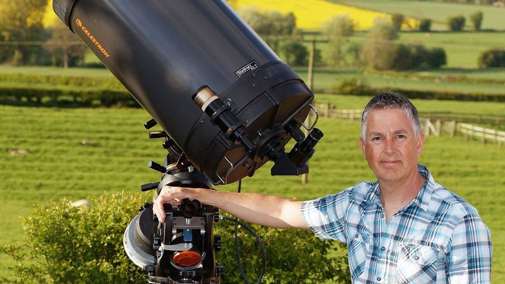 Photographer Jamie Cooper with his telescope. © Jamie Cooper Photography