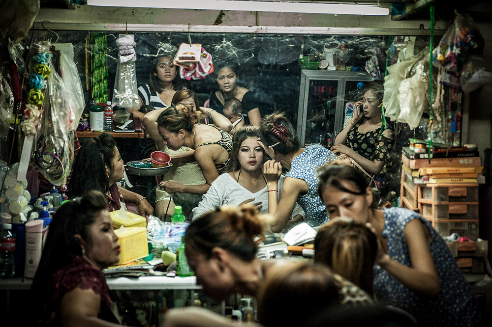 Female residents take the opportunity to socialise at the end of the day at the in-house beauty parlour on the ground floor of the White Building, Phnom Penh, Cambodia. Image: Tariq Zaidi