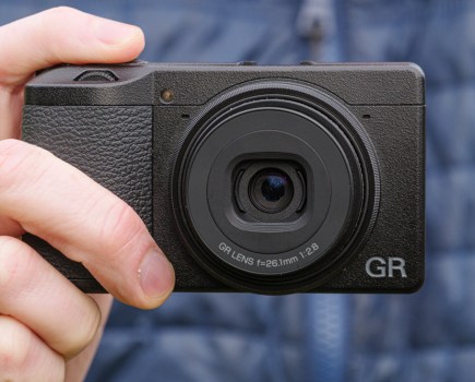 Ricoh GR IIIx in hand, close-up (Tim Coleman)