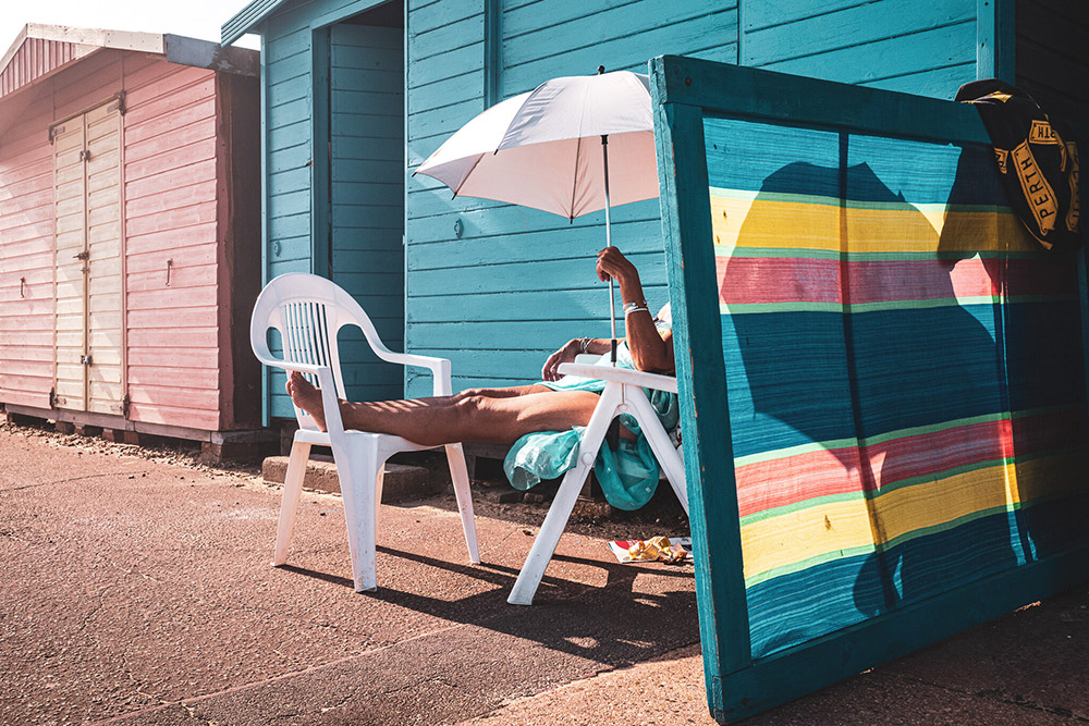 relaxing by a beach hut best of british apoy round