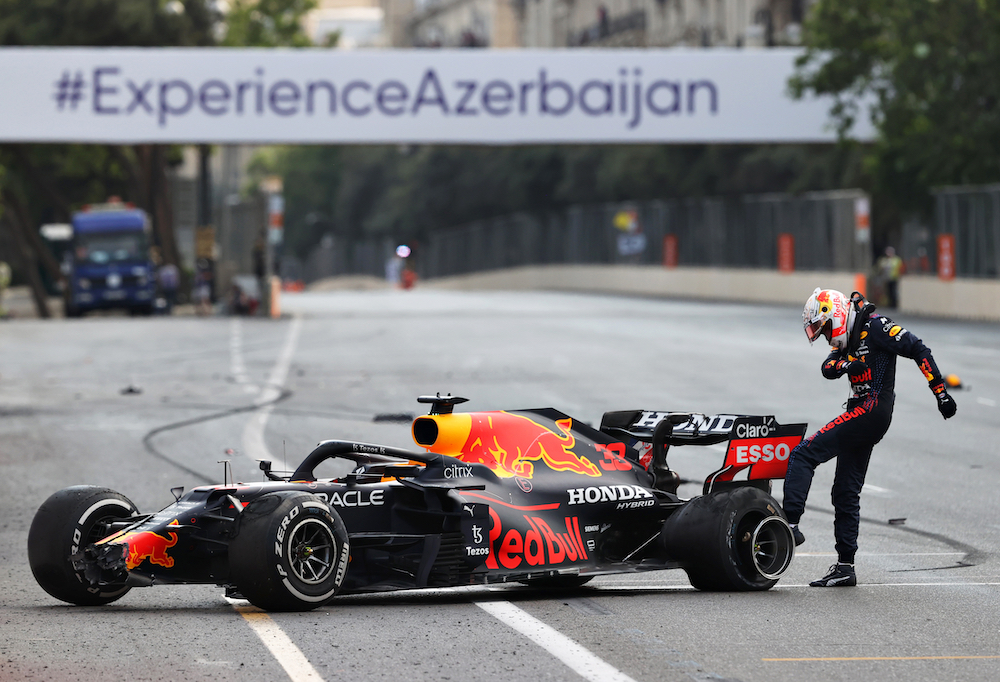 Max Verstappen of the Netherlands and Red Bull Racing kicks his tyre as he reacts after crashing during the F1 Grand Prix of Azerbaijan at Baku City Circuit on 6 June 2021 in Baku, Azerbaijan. © Clive Rose/Getty Images