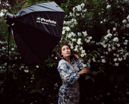 The Profoto A2 off-camera strobe unit being used on location with an umbrella