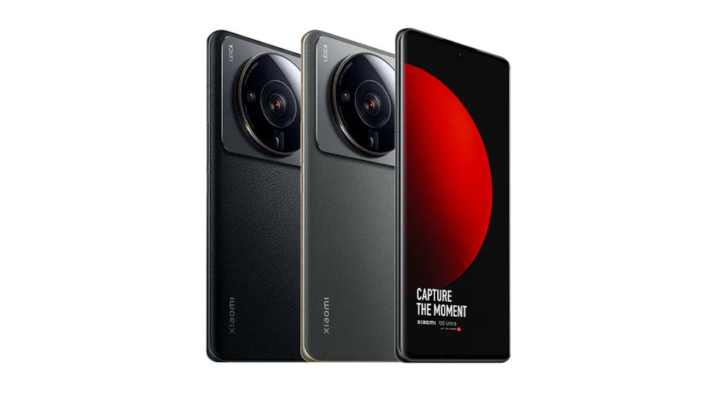 The Xiaomi 12S Ultra, three phones standing next to each other, two showing the back are the black and grey version and the third is facing forward with the screen 
