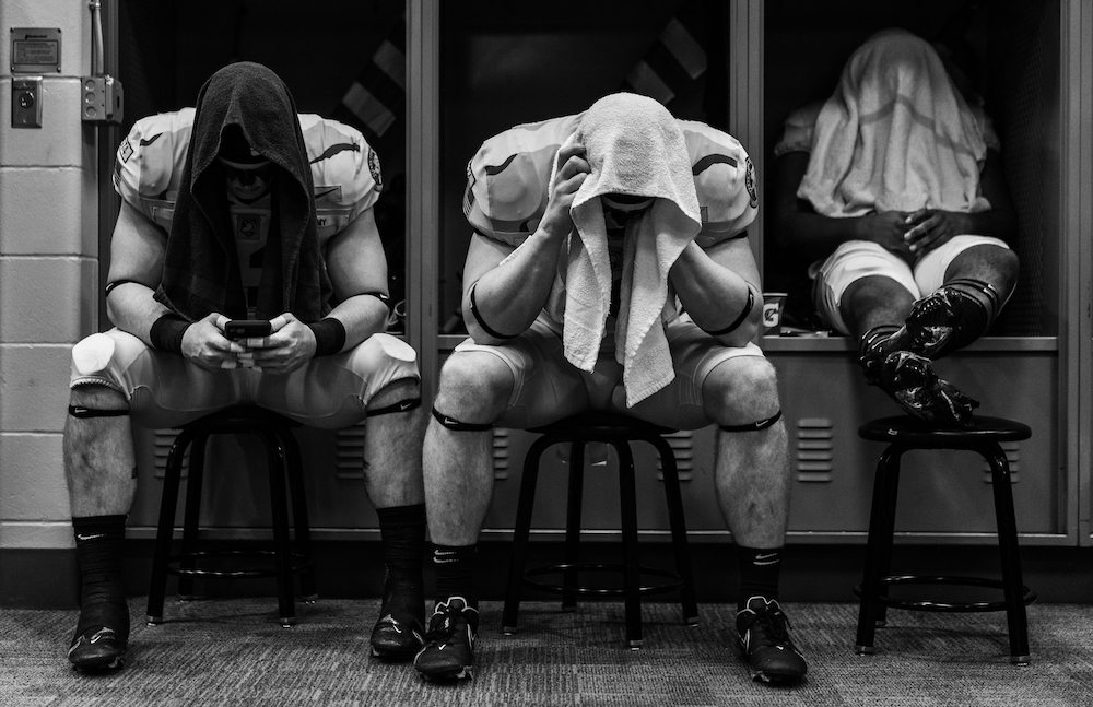 Wilson Catoe (#42), Cade Barnard (#40) and Jakobi Buchanan (#33) of the Army Black Knights in the locker room before the start of a game against the Navy Midshipmen at MetLife Stadium on 11 December 2021 in East Rutherford, New Jersey. © Dustin Satloff/Getty Images