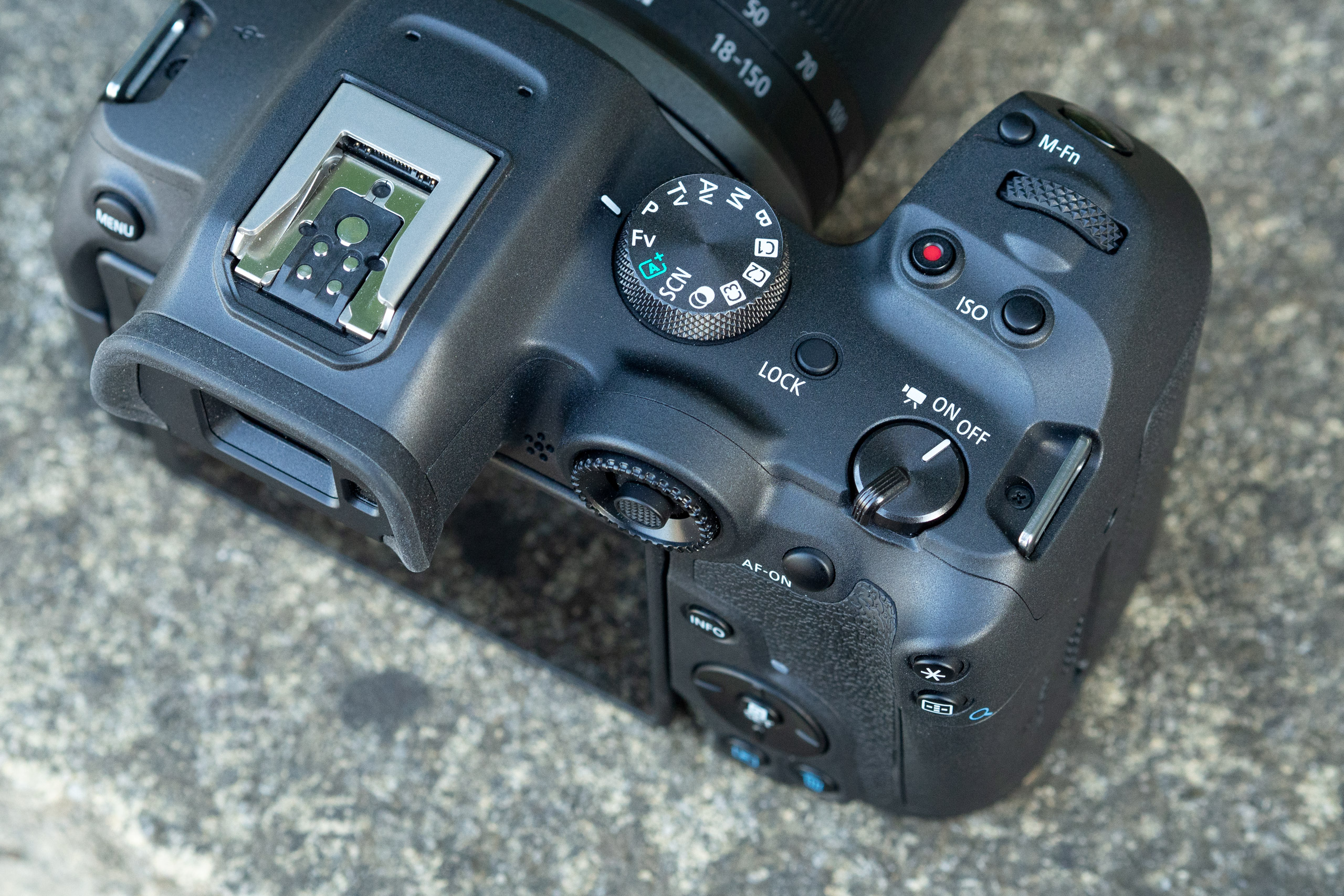 The top plate is relatively clean, with movie and ISO buttons placed behind the shutter release