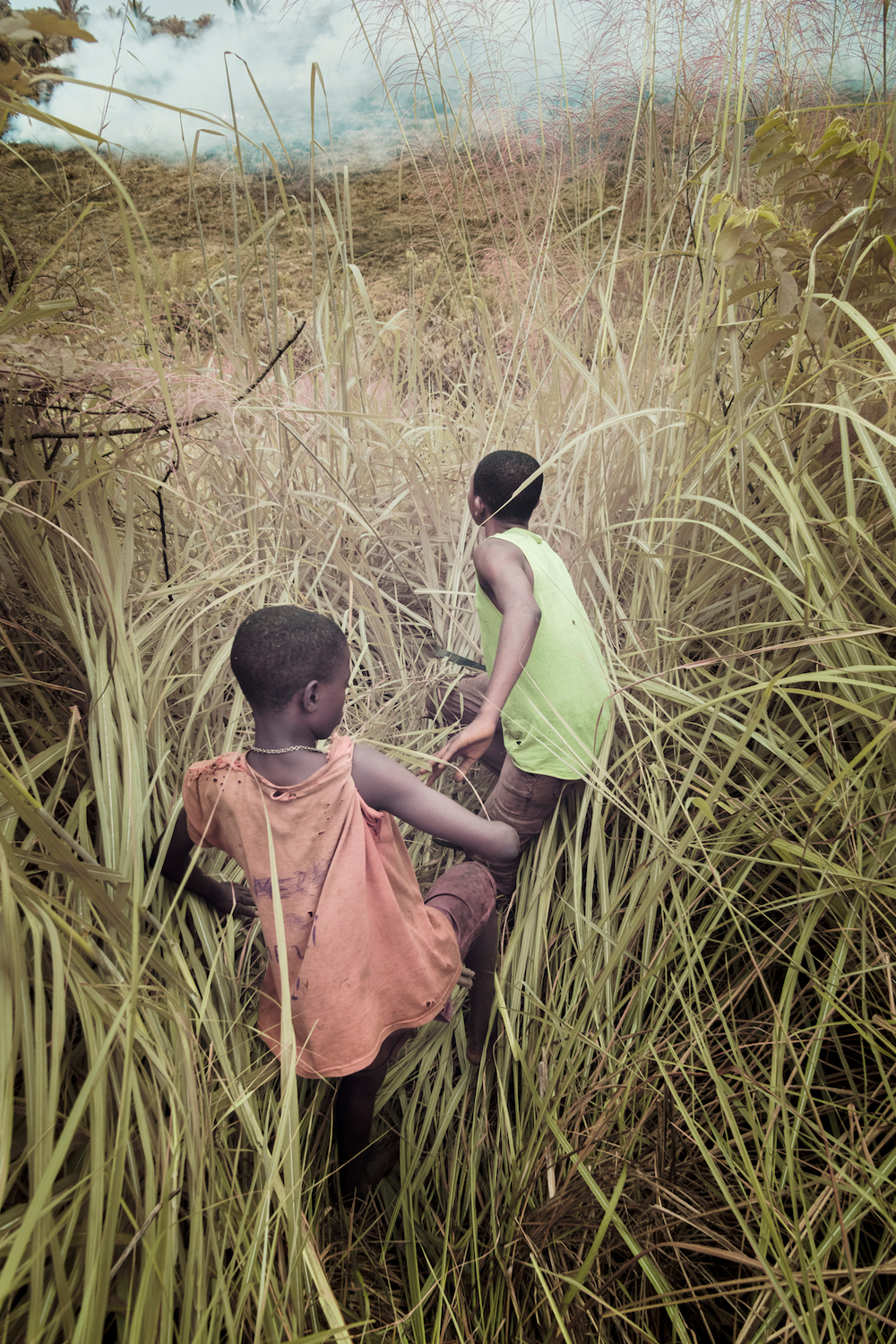 Two children, Gaston and Docteur, showing the way to a community project in Luntu village. © Léonard Pongo/LOBA 2022
