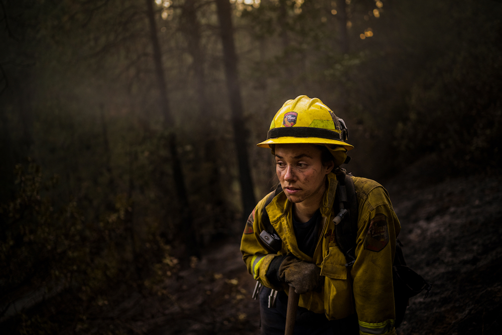 Madalyn Schiffel, 26 takes a break during a long day fighting fires that burned overnight near West Point Station in California, September 4, 2021. Fire fighters who have been with CAL FIRE for decades are saying that the seasons are getting longer and longer as drought stress combines with critical levels of forest fuel curing and burning earlier and earlier. © Lynsey Addario/LOBA 2022