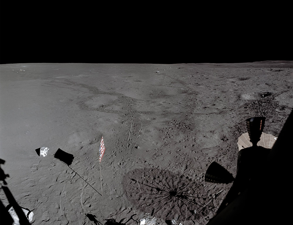 Apollo 14 February 6, 1971, HASSELBLAD 70MM. LENS 60MM F/5.6 | BY EDGAR MITCHELL, NASA ID: AS14-66-9336 TO 9343Back in the LM, the crew photographed the landing site just before leaving the Moon. This stitched panorama shows the scene asit would be found to this day. Mitchell’s discarded PLSS is lower left. Shepard hurled his own significantly further. The ALSEP is upper left, Turtle Rock upper center and the TV camera far right. Both golf balls are also visible (in the crater, above center, and upper left on the “lunar fairway”). (Panorama, fiducial mark removal, EL: 4/5)NASA / JSC / ASU / Andy Saunders