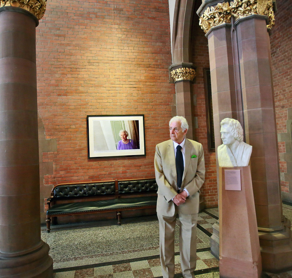 Harry Benson pictured at the unveiling of the official portrait of Queen Elizabeth II at the Scottish National Portrait Gallery in Edinburgh, 2014. © Harry Benson.