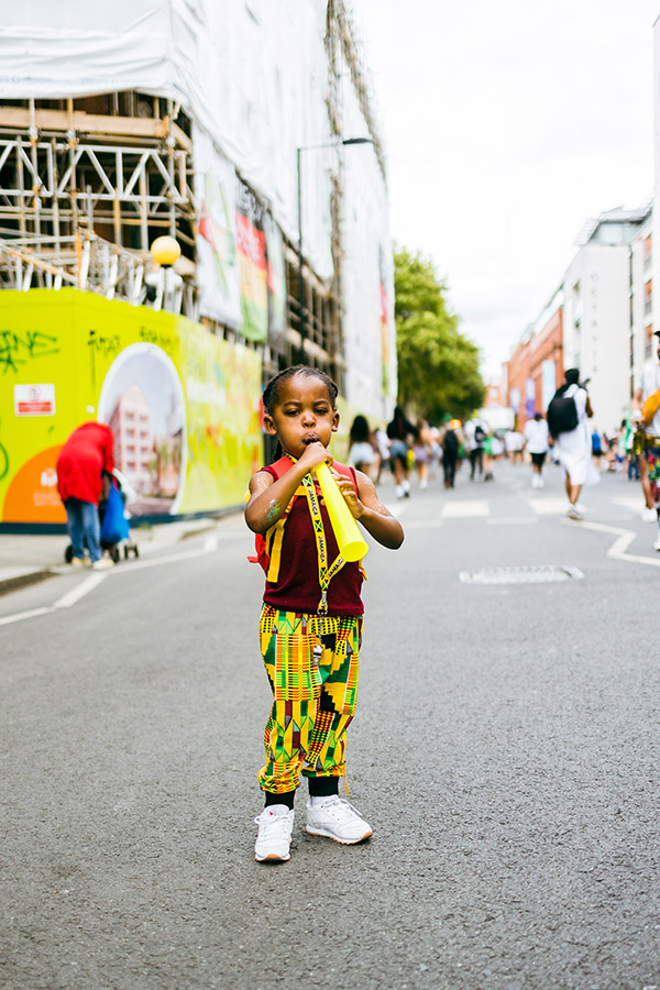 child on the streets of notting hill carnival