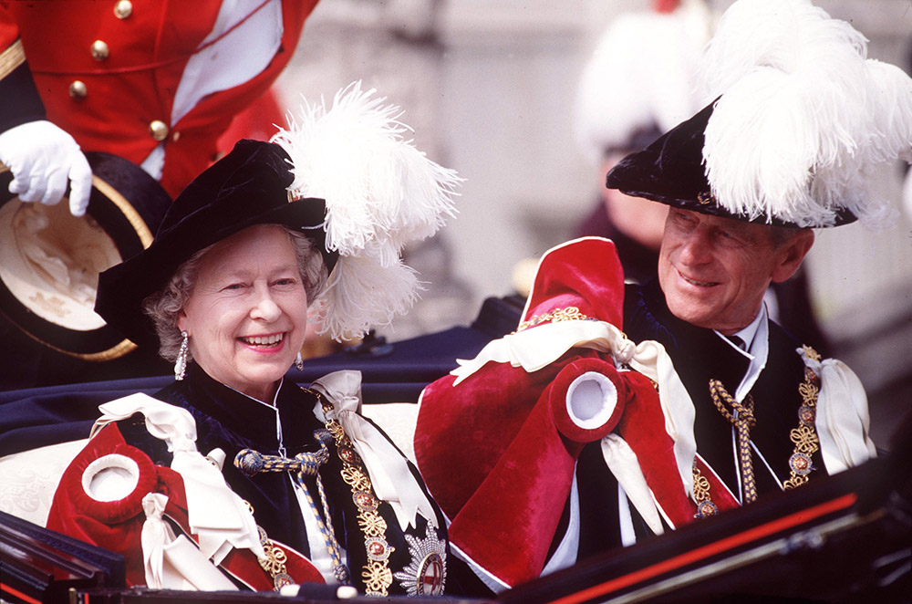 The Queen and Prince Philip pictured in the carriage procession following the Garter Service at Windsor Castle, 1994. © Tim Graham/Getty Images.
