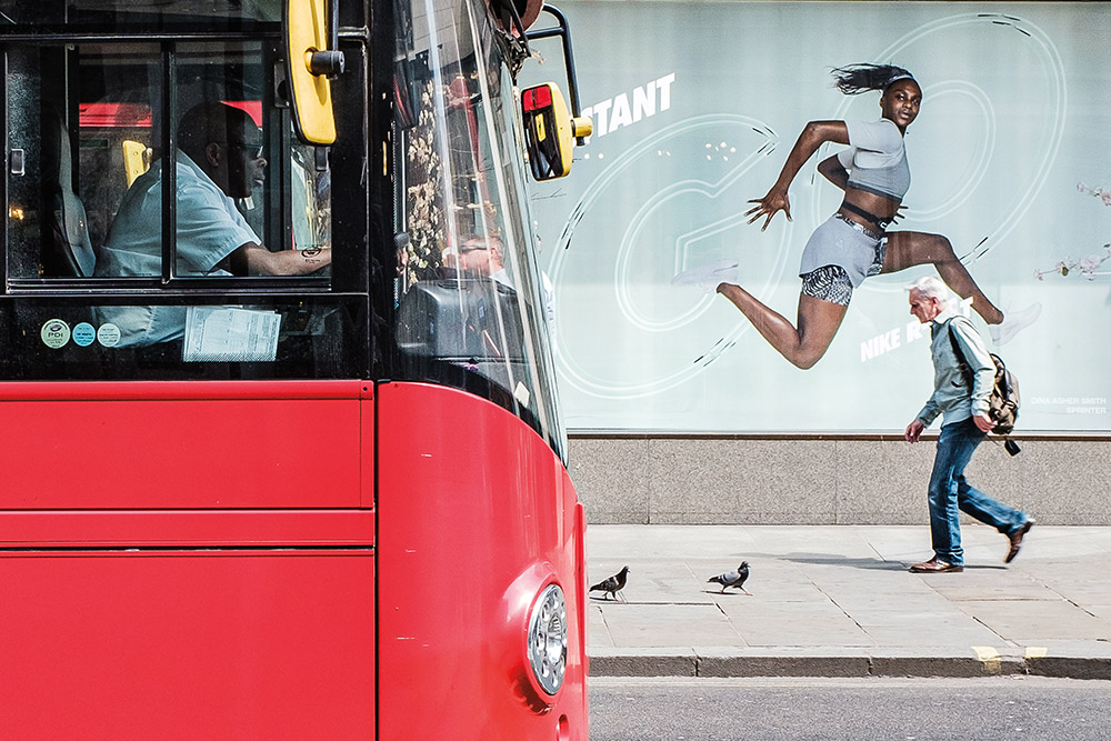 jon addecott london red double decker bus front passing shop urban photographers club street assignment