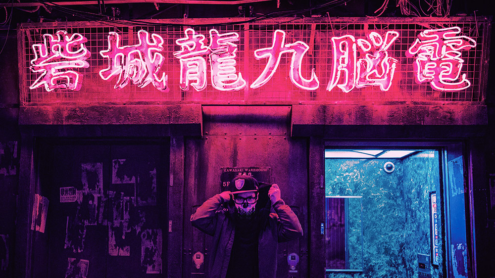 liam wong portrait in front of neon sign tokyo
