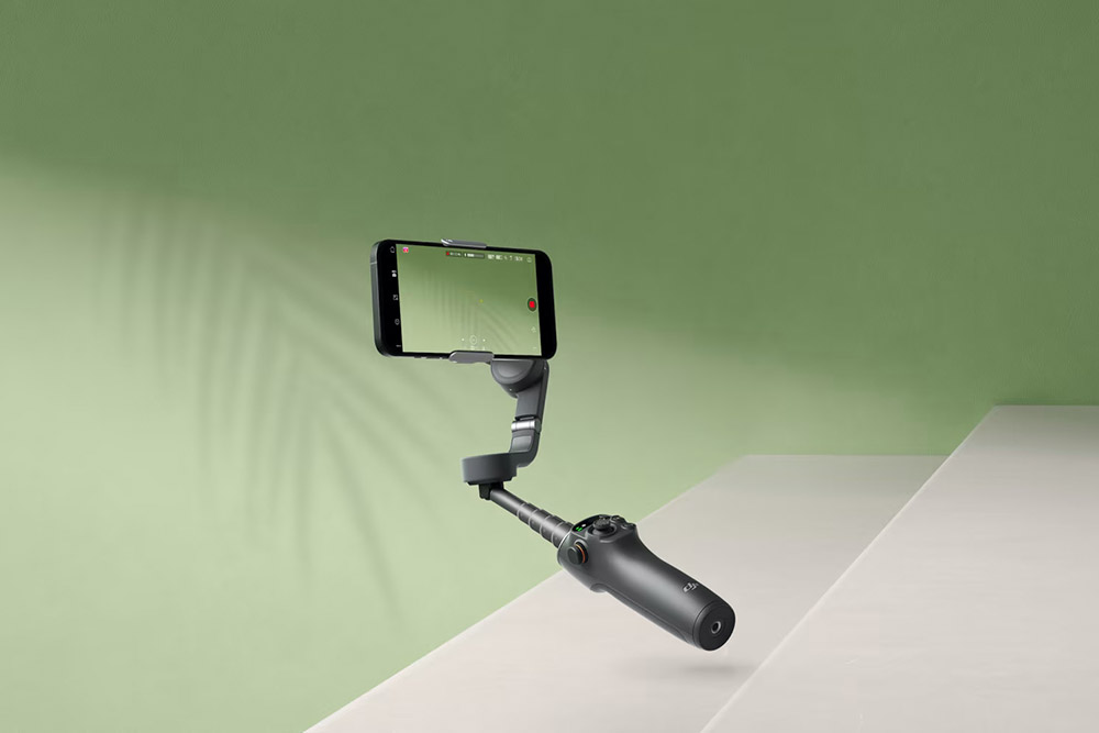 best camera phone tripods and mounts, DJI Osmo Mobile 6 on a green and grey background.