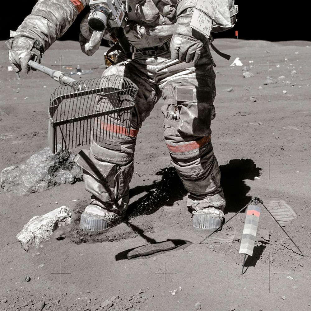 Apollo 16 mission commander John Young collecting moon dust.
