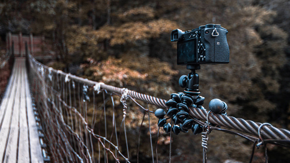 camera on joby gorillapod attached to a rope bridge flying with camera kit