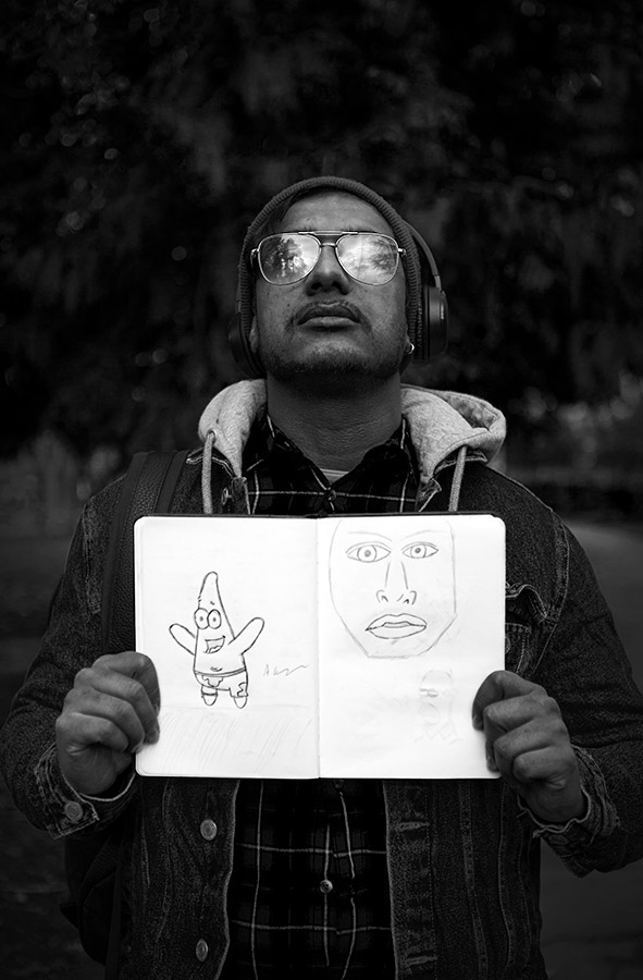 – Arun holding one of his note books, representing the eyes of his inner child versus his current vision. 