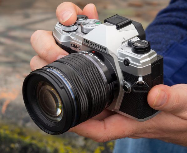 OM System OM-5 in hand and reviewed - Photo: Jeremy Waller
