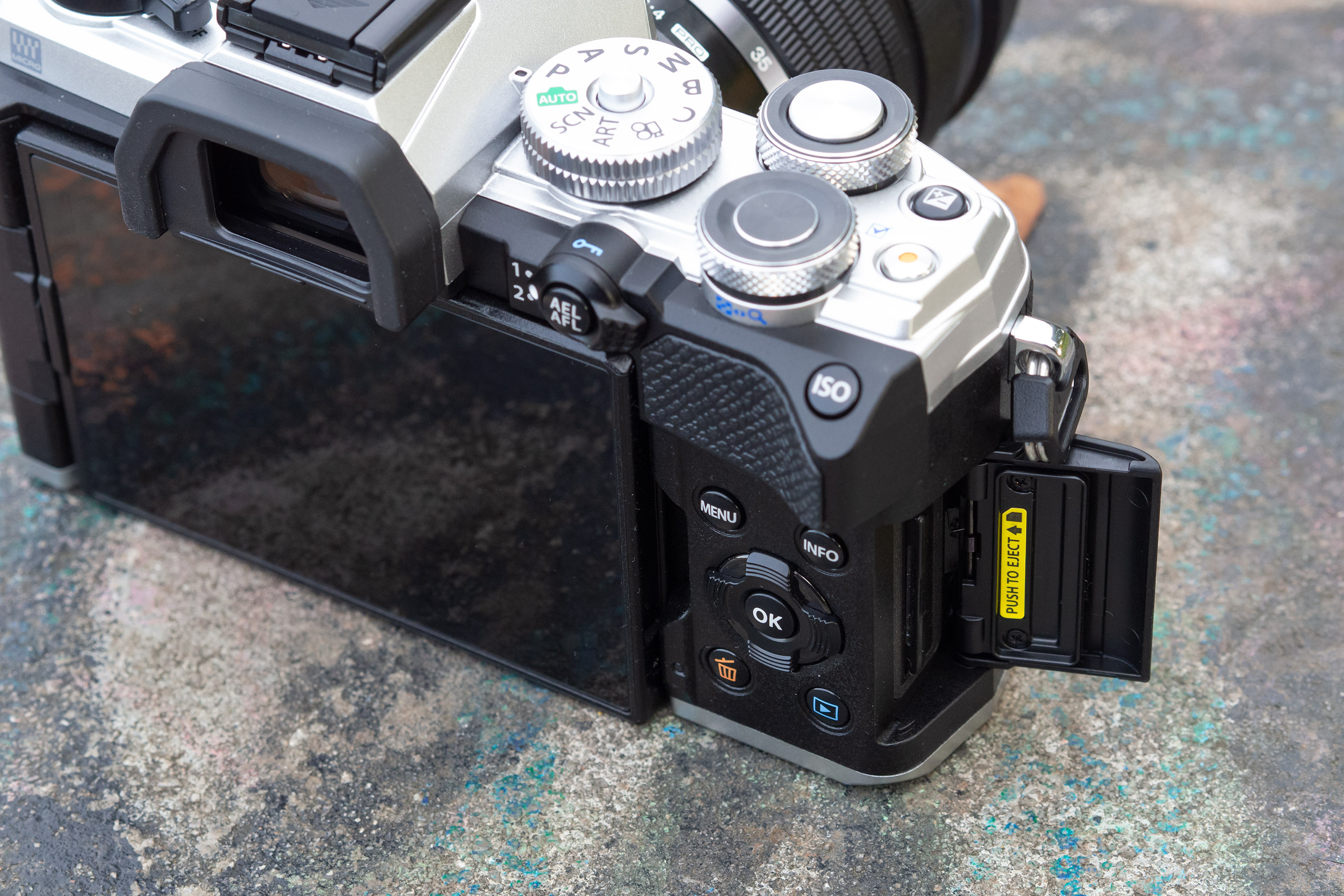 The OM System OM-5 includes side access to the memory card slot, and supports UHS-II SD cards, photo: Joshua Waller
