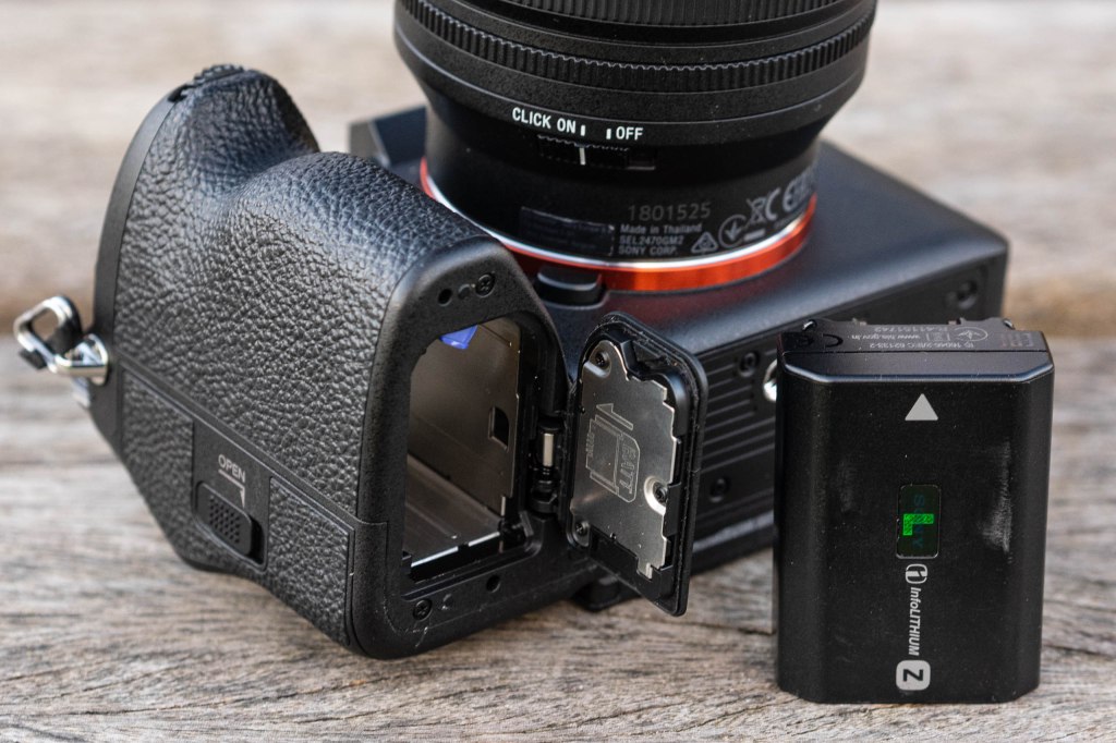 Sony A7R V battery door open and battery on the side