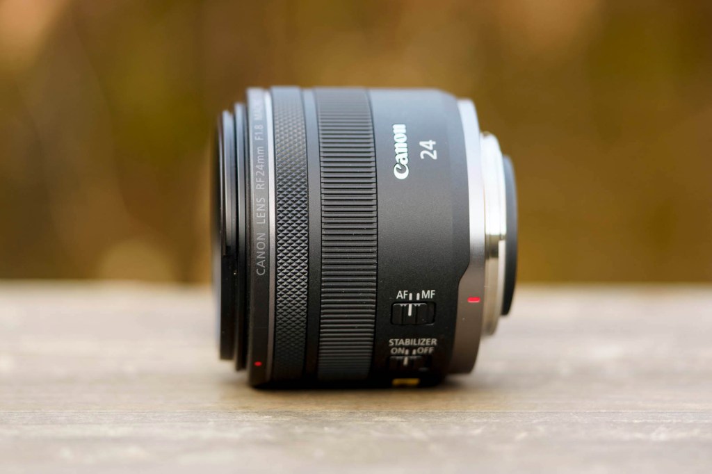 Canon RF 24mm F1.8 lens on a table side view