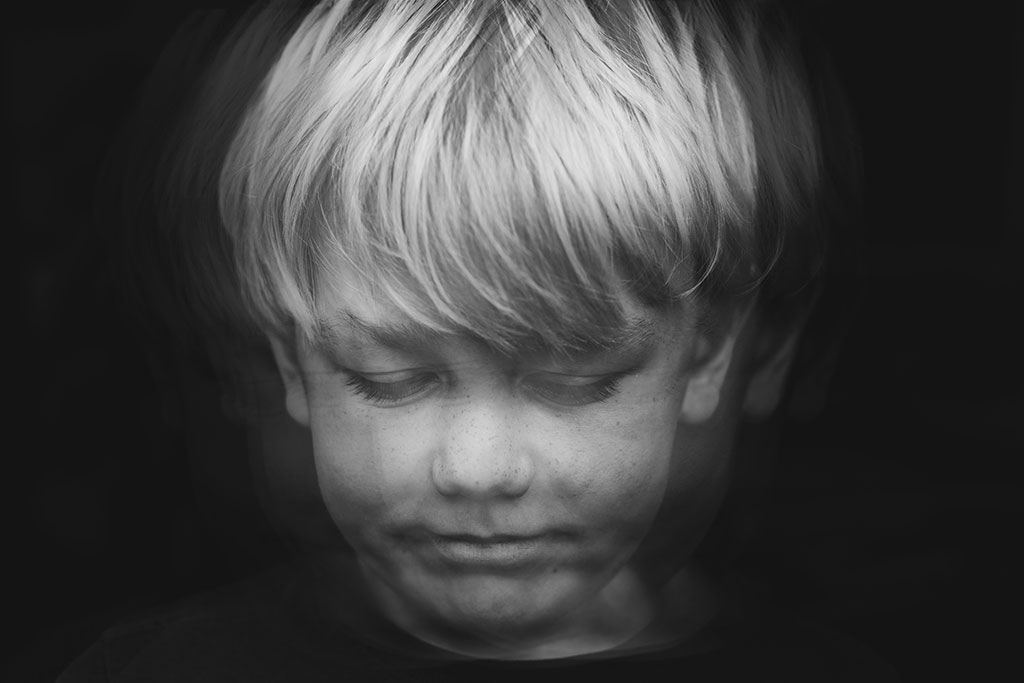 multiple exposure young boy face