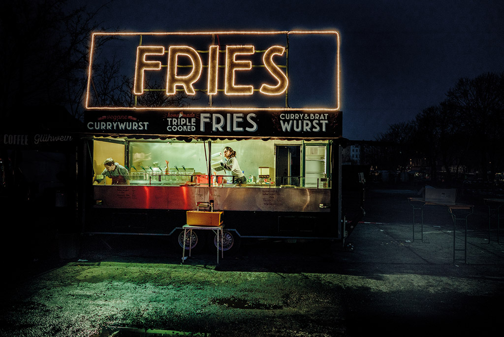 Mauerpark, Berlin neon fries sign. best cities for street photography