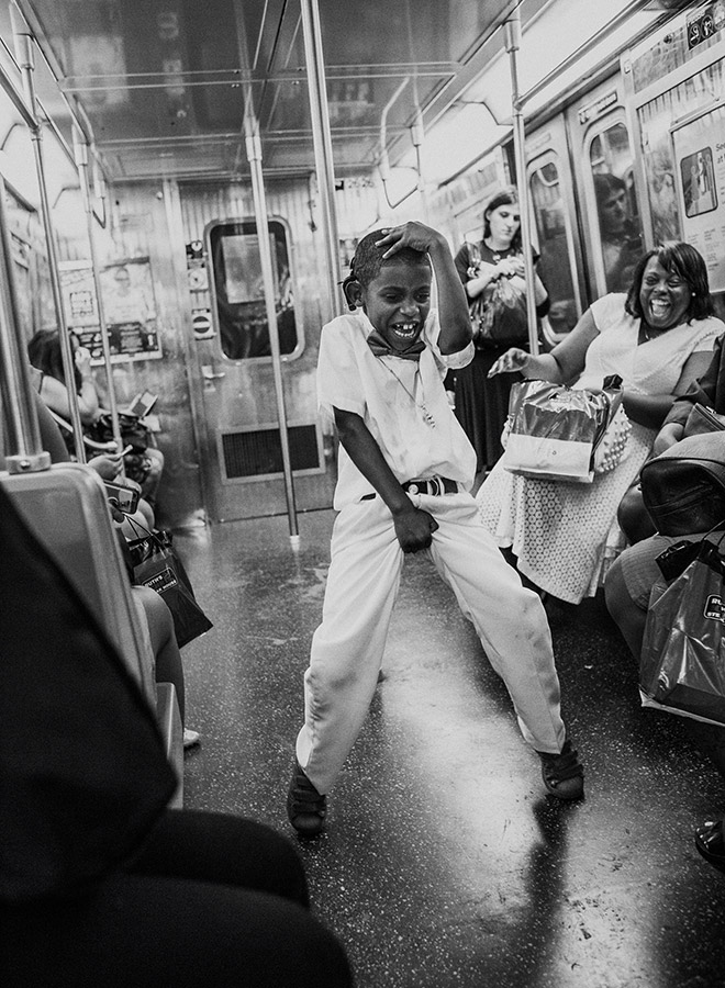 child dancing on the subway