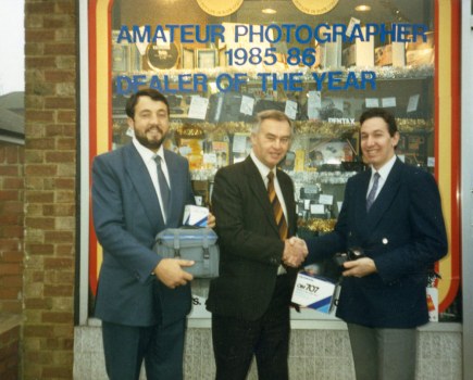 Reg Atkins (left) standing outside Park Cameras in 1986.