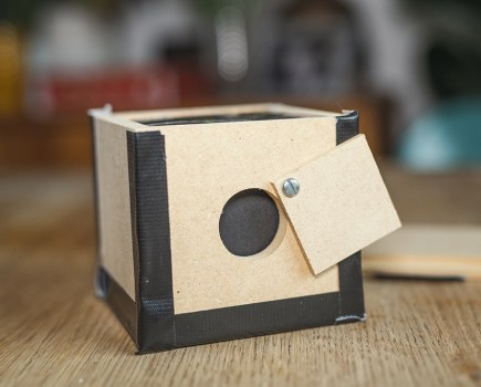 make a pinhole camera shutter using a piece of wood