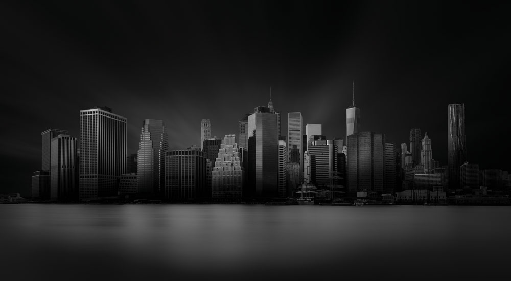 Black and white building photography, Billy Currie. New York skyline, long exposure low key image.