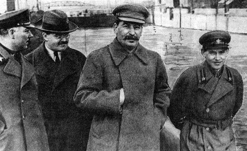 Russia / Soviet Union: Josef Stalin walking with Vyacheslav Molotov (left) and Nikolai Yezhov (right), Moscow, 1937.