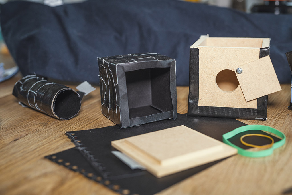 pinhole camera making light proof box by sealing with black tape