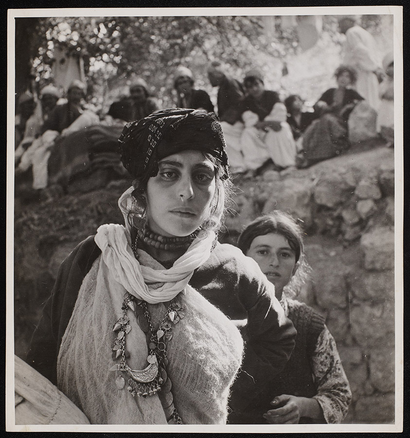 A Yazidi woman at Lalish18 October 1946 The Anthony Kersting Archive, Conway Library, Courtauld Institute of Art. Released under a CC BY-NC 4.0 licence Lalish is a mountain valley in Kurdistan and is the spiritual home of the Yazidis. After visiting in 1944, Kersting returned to Kurdistan two years later from Cyprus on route back to London. He was eager to photograph a seven-day Yazidi celebration called The Feast of the Assembly, held in October each year in honour of Sheikh Adi. This photograph of a Yazidi woman is one of a number of striking portraits he made at the festival.