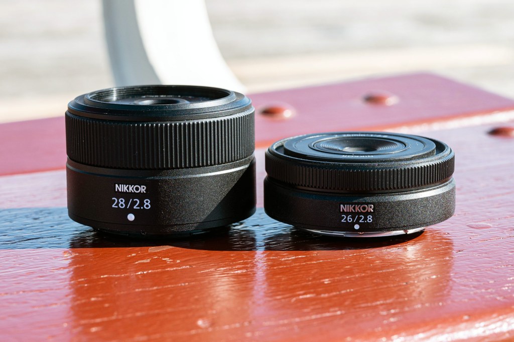 Nikon Z 26mm f/2.8 prime pancake lens next to the 28mm f/2.8 Photo: Amy Davies