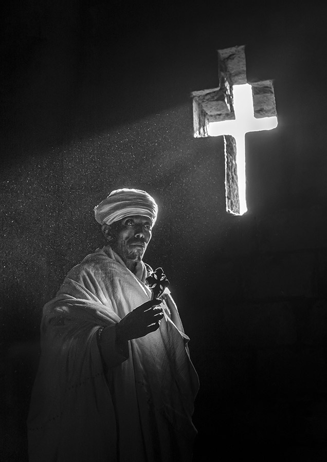 priest meditating Biete Queddus Mercoreus church, Lalibela, Ethiopia