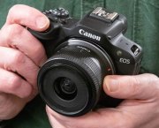 Canon EOS R100 in-hand