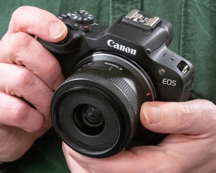 Canon EOS R100 in-hand
