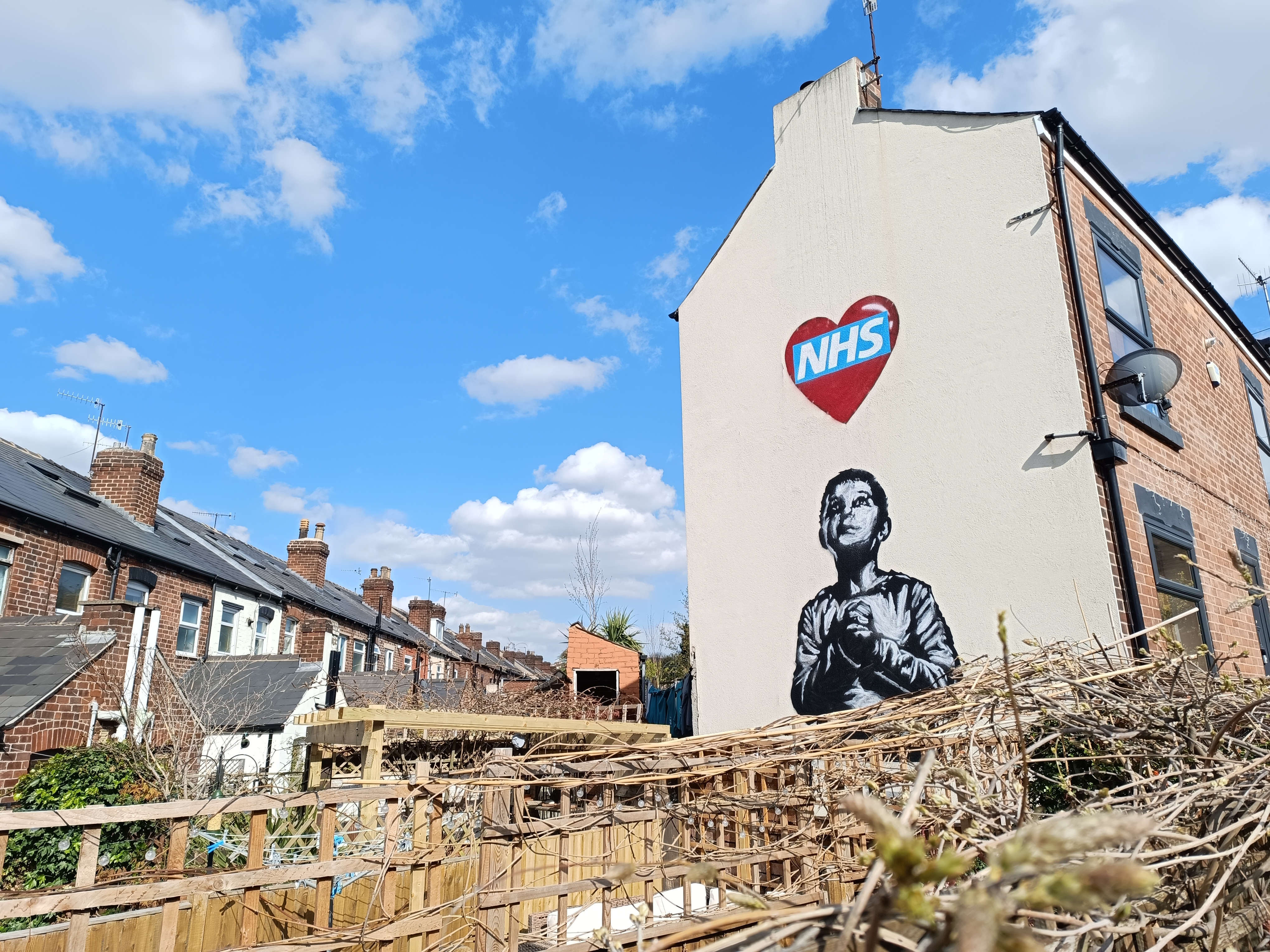 Redmi Note 12 Pro+ camera phone sample image, street art for NHS on the side of a building