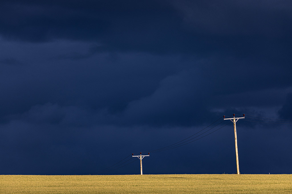 deep azure sky, with the gold strip at the bottom and the two pylons