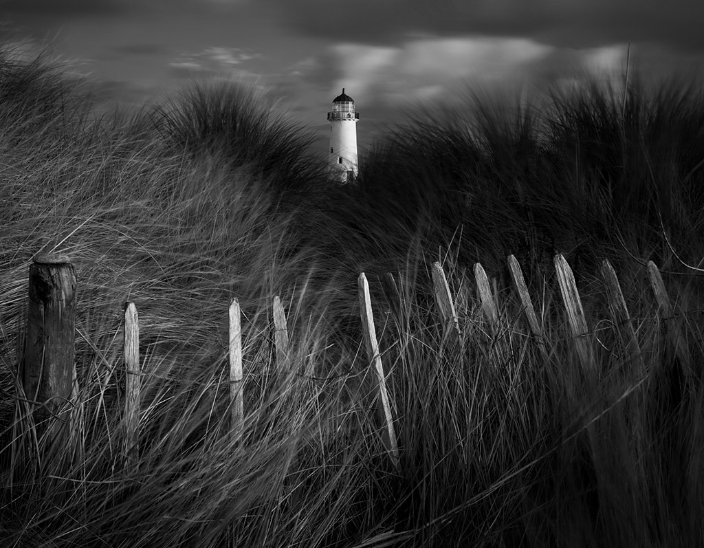 landscape lighthouse moody monochrome scene with long grass