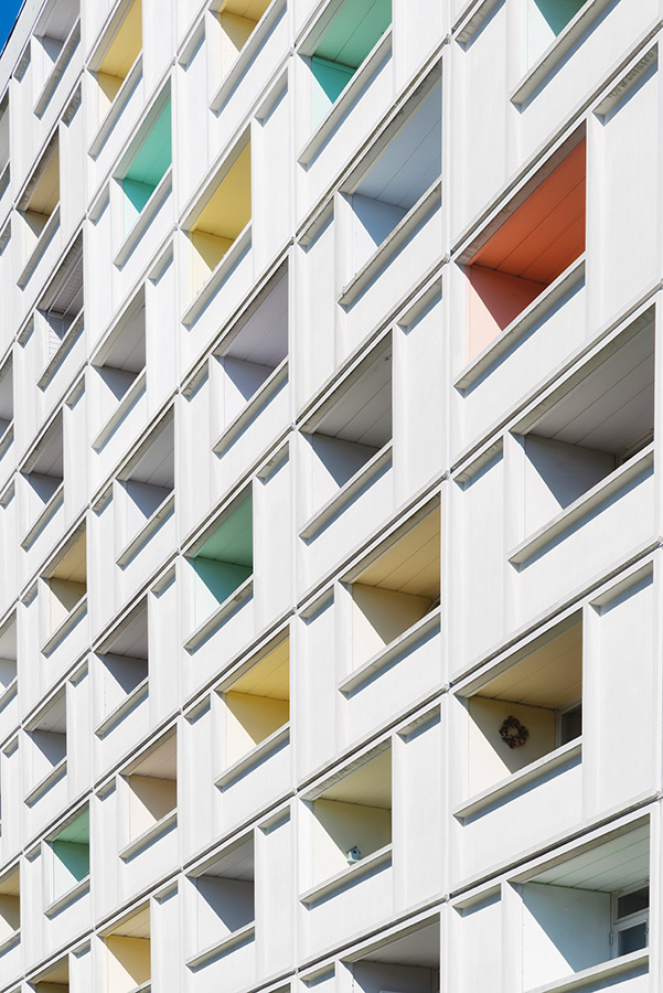 close up of abstract architecture coloured window holes in white building